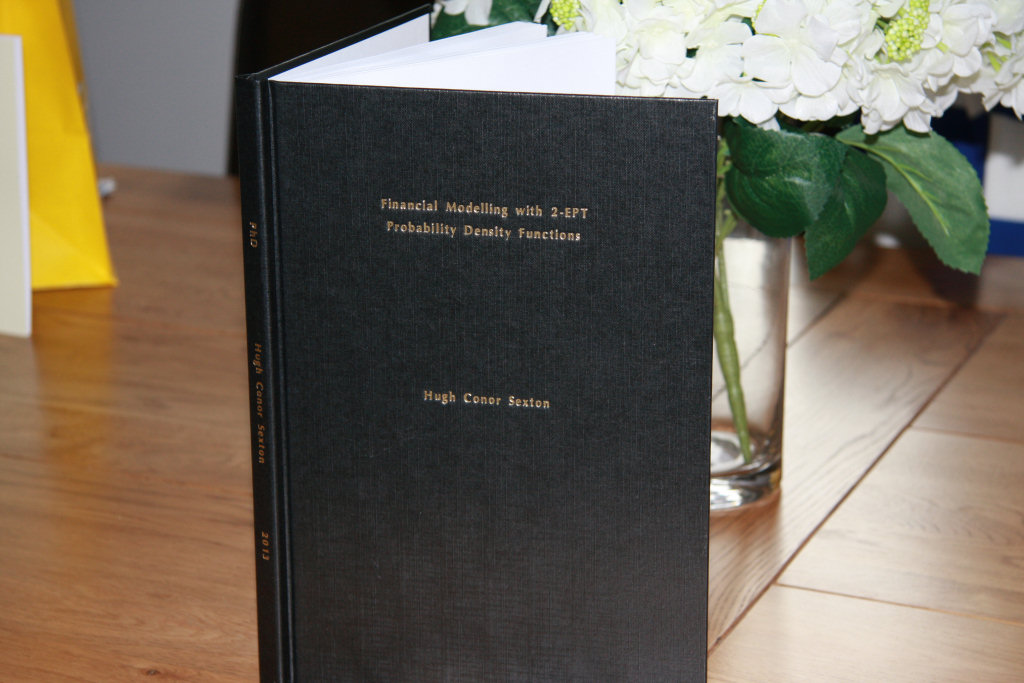 Hard Back Thesis Binding with Godl Letttering Standing